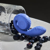 Snail Gizi Lite Dual G-spot Stimulator - SVIBE in blueberry with real blueberries. #color_blueberry