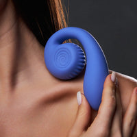 Snail Gizi Lite Dual G-spot Stimulator - SVIBE in blueberry, held by a woman, displaying ergonomic design. #color_blueberry