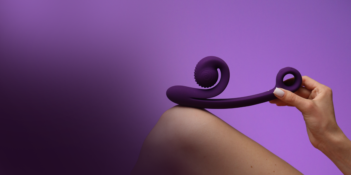 Purple Snail Curve held against a shoulder